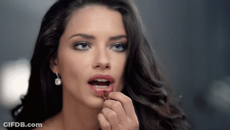 Adriana Lima Using Lipstick GIF