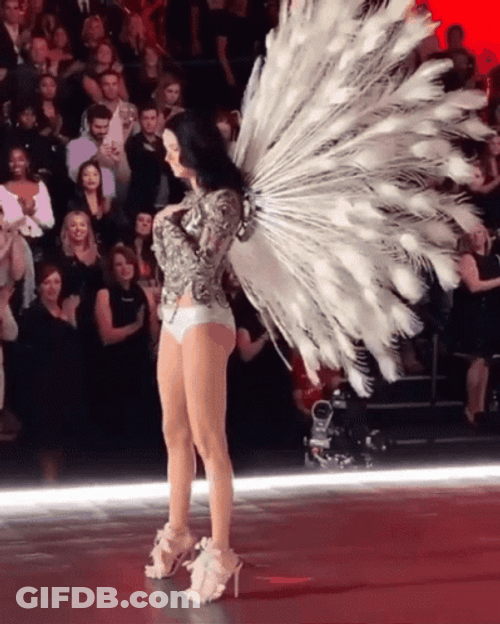 Adriana Lima Using Peacock Feathers GIF