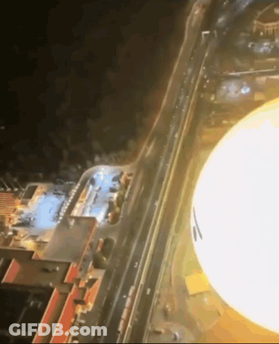 Aerial City At Night With Large Light GIF
