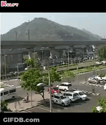 Aerial Parking Lot With Cars And Mountain GIF