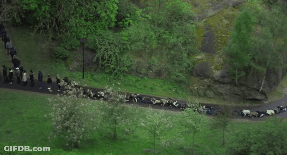 Aerial Shot People Falling Down Domino Effect GIF