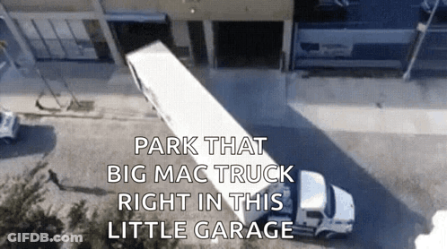 Aerial View Big Mac Truck Parked In Little Garage GIF
