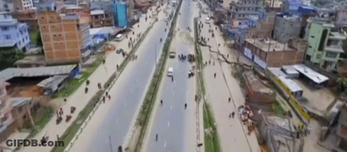 Aerial View Busy City Street TNT Sign GIF