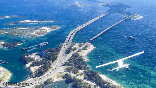Aerial View Of Bridge Over Water With Plane GIF