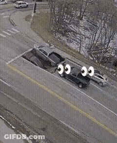 Aerial View Of Car Stuck In Road Hole GIF