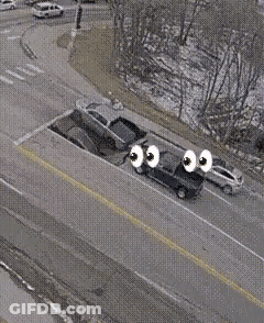 Aerial View Of Car With Eyes Driving Down Road GIF