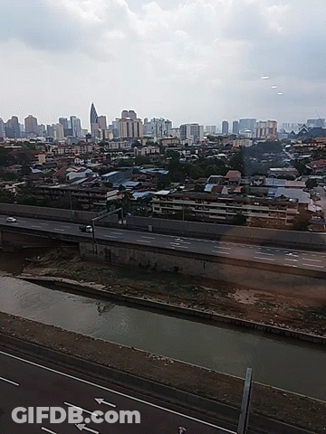 Aerial View Of City With Arrows Pointing Left And Right GIF