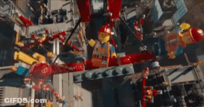 Aerial View Of City With Lego Figures Flying Overhead GIF