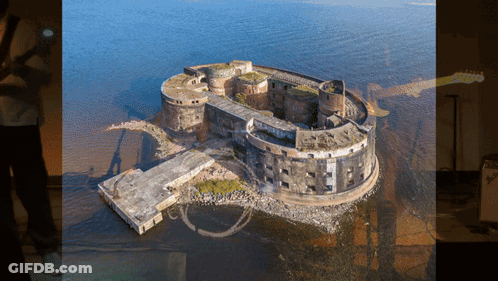 Aerial View Of Large Building In Ocean GIF