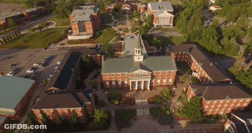 Aerial View Of Large Building With Clock Tower GIF
