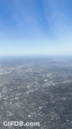 Aerial View Of Large City With Blue Sky GIF