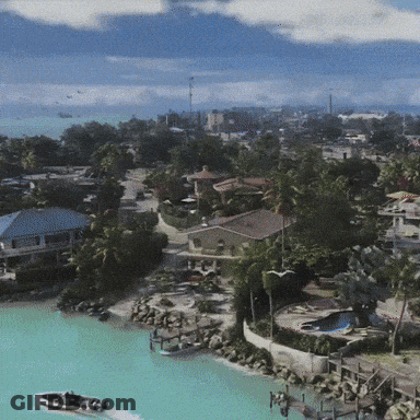 Aerial View Of Tropical Island With Boat GIF