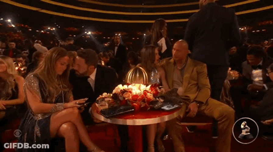 Affleck And Rock Sitting Beside Couples GIF