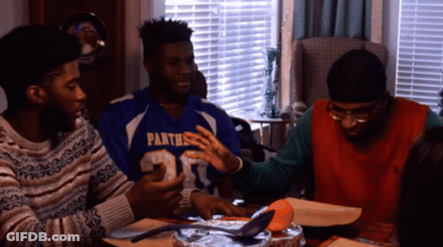 African American Christmas Guy Opening Food GIF