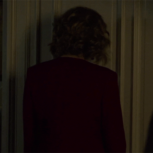 Agitated Lady Bangs Head Against Wall GIF