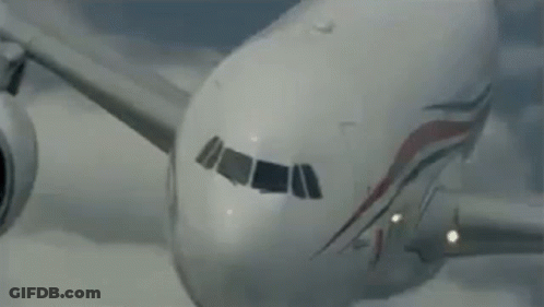 Airplane Flying Through Sky GIF