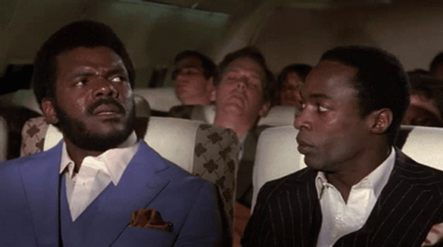 Airplane Movie Confused Men Looking Back GIF