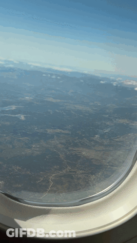 Airplane Window View Of Landscape GIF