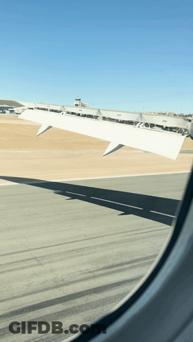 Airplane Wing Visible Through Window GIF