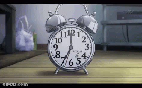 Alarm Clock On Wooden Floor GIF