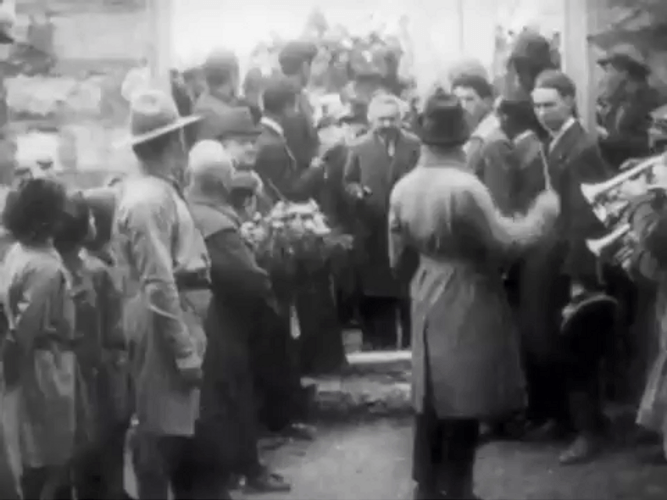 Albert Einstein Enters And Holds Flower GIF