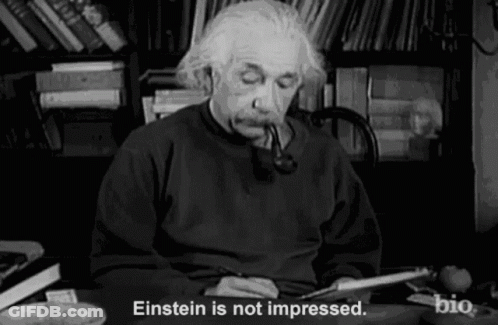 Albert Einstein Smoking Pipe At Desk GIF