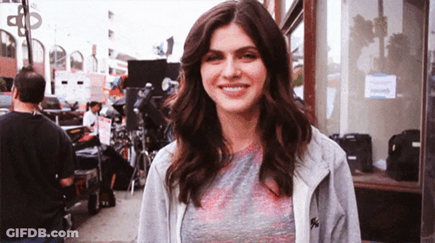 Alexandra Daddario Shrugging Big Smile GIF