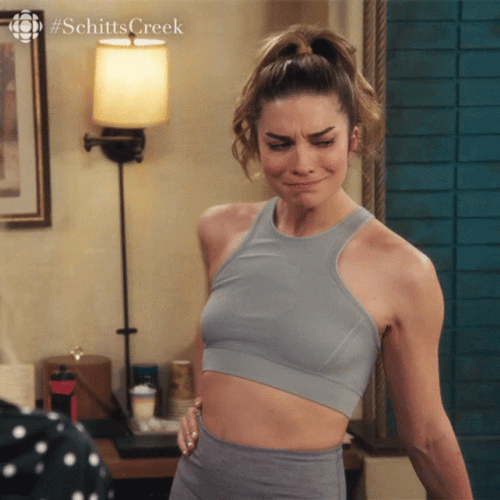 Alexis Rose Checking Her Figure GIF