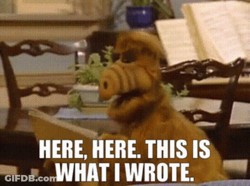 Alf From The Sitcom Alf Says " Here Here This Is What I Wrote " While Reading A Book GIF