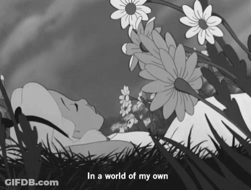 Alice In Wonderland Lying In Grass GIF