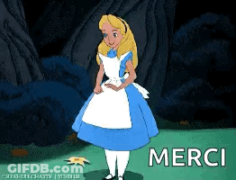 Alice In Wonderland Standing In Field Saying Merci GIF