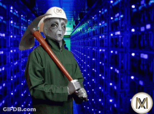 Alien In Hard Hat Holding Pickaxe In Front Of Servers GIF