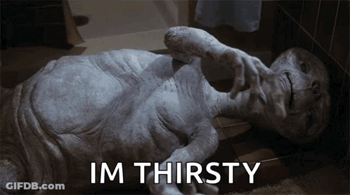 Alien Laying On Floor Saying Im Thirsty GIF