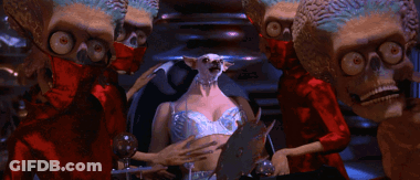 Aliens Standing Around Woman GIF