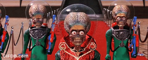 Aliens Standing On Red Carpet With Guns GIF
