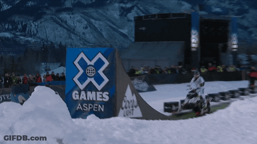 Amazing Snowmobile Jump And Backflip GIF