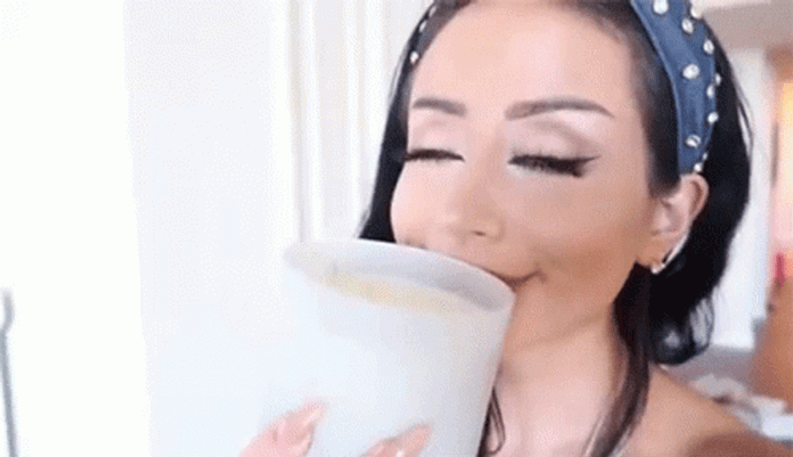 Amber Scholl Fascinated Sniffing Candle GIF