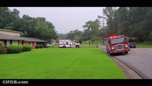 Ambulance And Fire Truck Parked In Front Of House GIF