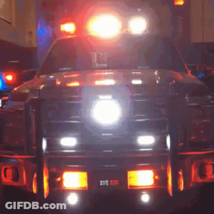 Ambulance Front Lit Up With Number 10 On Bumper GIF