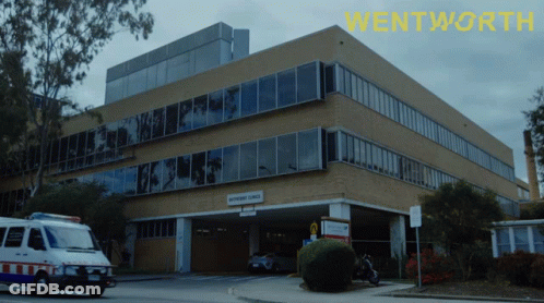Ambulance Parked In Front Of Wentworth Building GIF