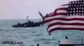 American Flag Flying Near Ship In Ocean GIF
