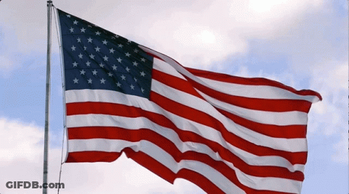 American Flag Waving In Wind With Cloudy Sky GIF