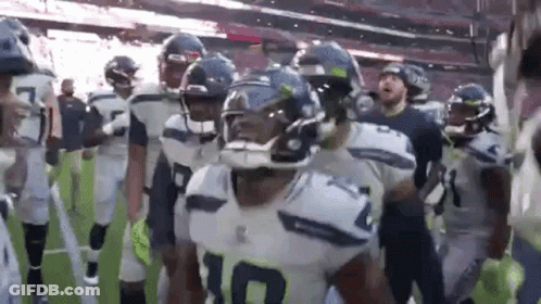 American Football Players Walking Off Field GIF