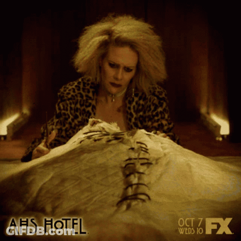 American Horror Story Hotel Woman Laying On Dead Body GIF