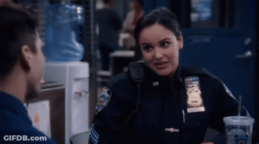 Amy Santiago Nervous Laugh GIF