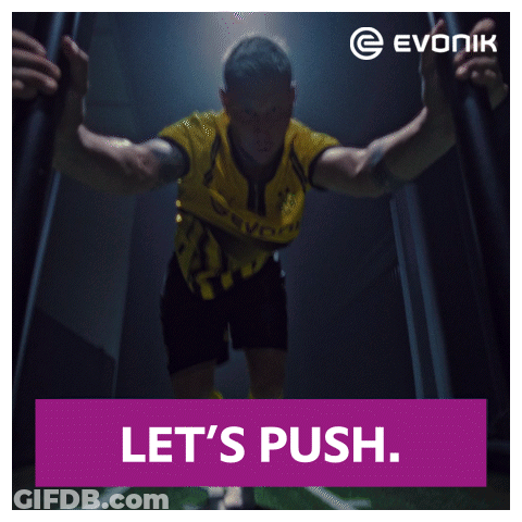An Ad For Evonik Shows A Man In A Yellow And Black Uniform GIF