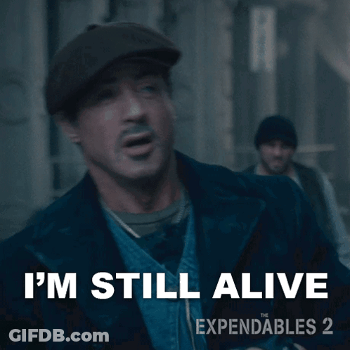 An Ad For Expendables 2 Shows A Man Wearing A Hat GIF