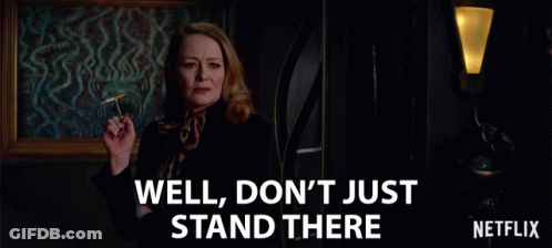 An Ad For Netflix Shows A Woman Smoking A Cigarette And Says Well Don 'T Just Stand There GIF