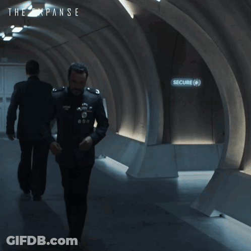 An Ad For The Expanse Shows A Man And A Woman GIF