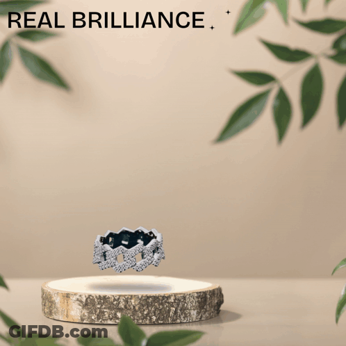An Advertisement For Real Brilliance Shows A Ring On A Wooden Podium GIF